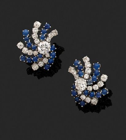 Pair of ear clips adorned with a main brilliant...