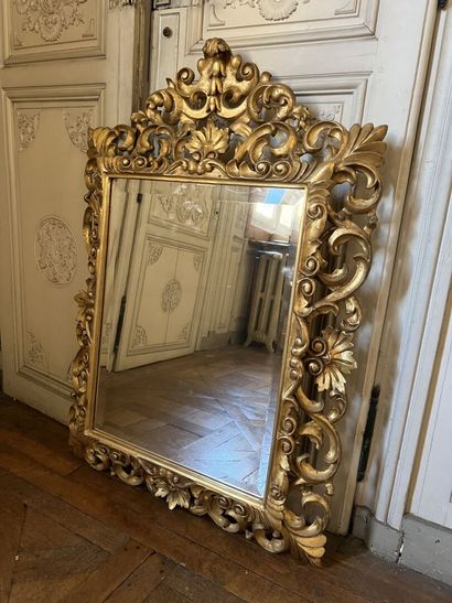 Carved and gilded wood mirror, the openwork...