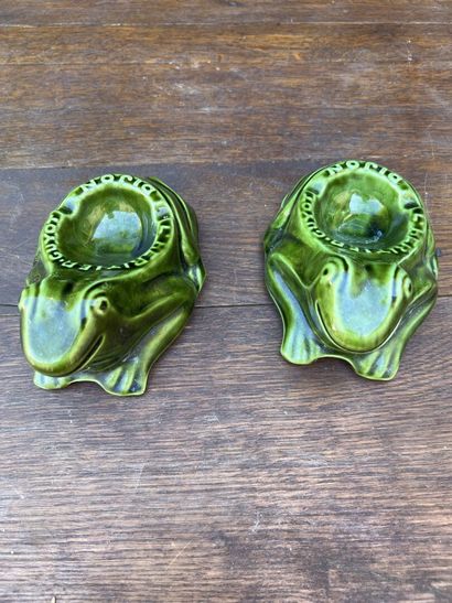 Two ashtrays in green glazed earthenware...