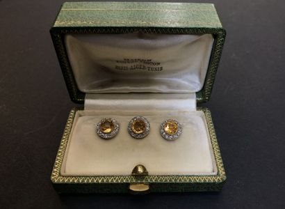 null Set of gold breastplate buttons, fine yellow stones surrounded by diamonds

Weight...