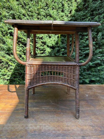 Wood and wicker magazine table

H. 54, W....