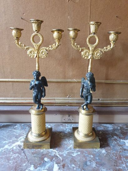 Pair of chased bronze candelabras with patina...