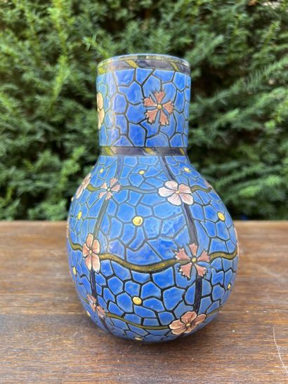 null Vase in blue enamelled glass with flowers.