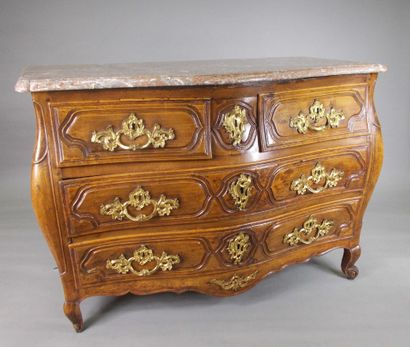 Louis XV period curved chest of drawers.

In...