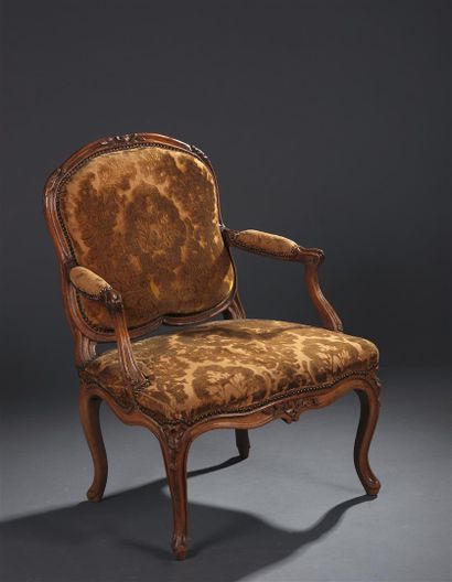 Molded and carved wood armchair, stamped...