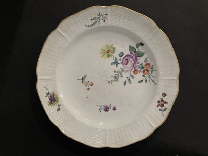 null Frankental

Two porcelain plates with polychrome decoration of flowers and basketry...