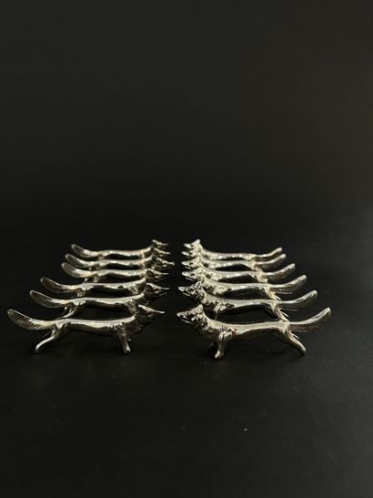 Suite of 12 silver-plated metal knife holders

2...
