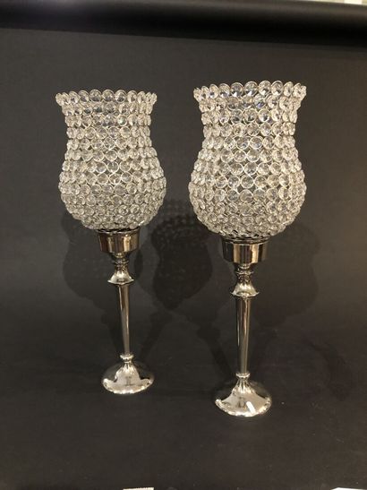 Pair of candle holders in metal

H.49,5 ...