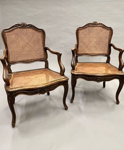 Pair of caned armchairs in molded and carved...