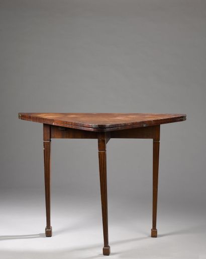 null Mahogany and mahogany veneer folding game table, late Louis XVI period
Fully...