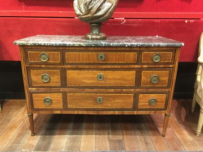 null A Louis XVI period rosewood veneer and light wood fillets chest of drawers.
It...