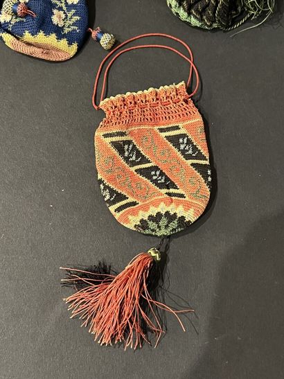 null Meeting of four purses, circa 1830, in polychrome silk knit, two with flowers,
fringed...