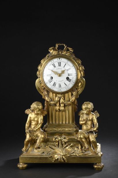 null Transitional period chased and gilt bronze clock by Osmond.
The dial and the...