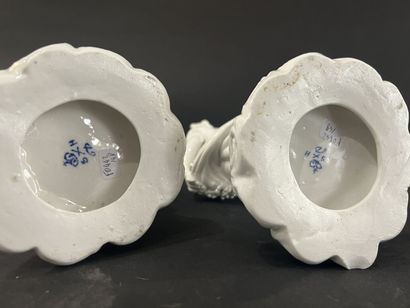 null Pair of enamelled porcelain groups decorated with young girls on a mound. 
Marked....