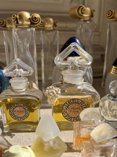 null MANNETTE of various perfume bottles (Givenchy, Guerlain, Dior)
and suite of...