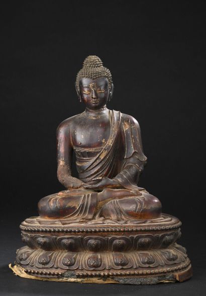 STATUE OF A BUDDHA in dry lacquer
CHINA,...