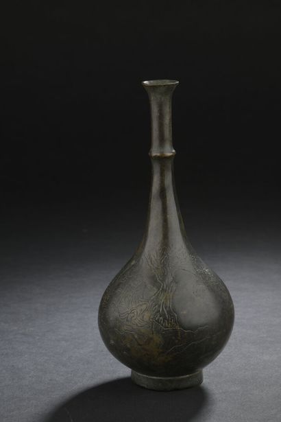 null SMALL VASE with long neck in incised bronze
CHINA
The globular body decorated...