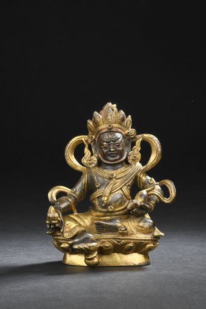 null Gilded bronze KUBERA STATUTE
CHINA, possibly 18th century
Depicted seated in...