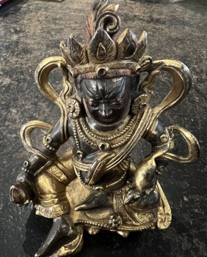 null Gilded bronze KUBERA STATUTE
CHINA, possibly 18th century
Depicted seated in...
