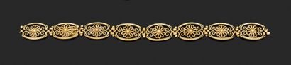 null BRACELET RUBAN articulé composed of eight oval motifs in filigree yellow gold....