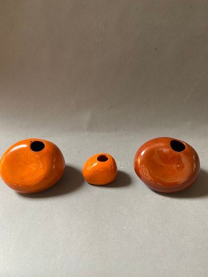null MODERN WORK
Set of three orange and brown glazed ceramic vases with deformed...
