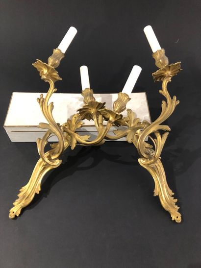 null Pair of ormolu sconces in the Louis XV style, 
With two arms of light decorated...