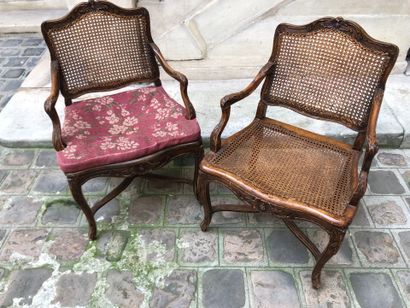 null Pair of Louis XV period natural wood caned armchairs
Four curved legs joined...