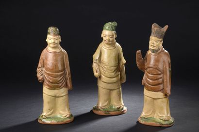 null Three statuettes of men in beige, green and brown glazed stoneware
China, 20th...