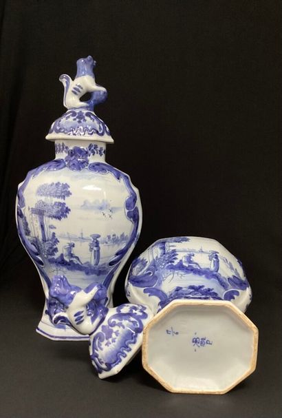 null DELFT - 19th century : 
Pair of covered earthenware vases decorated with landscapes.
Marked.
H...