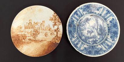 null TWO earthenware PLATES, one with brown sepia decoration of the old castle of...