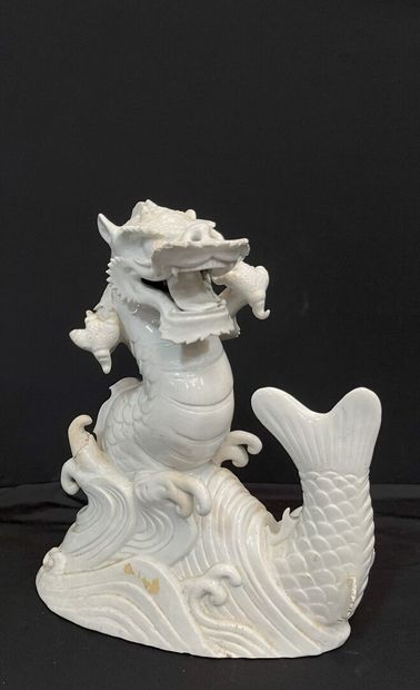 null CHINA - Early 20th century: 
Dragon and carp. 
Porcelain proof with white slip....