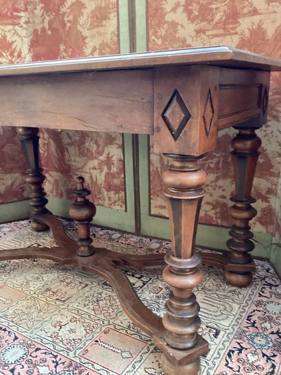 null A molded walnut TABLE in the Louis XIV style, opening with a drawer in the waistband...