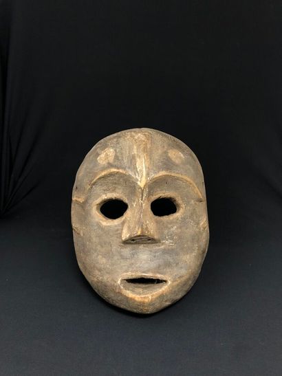 ART PREMIER Anthropomorphic carved monoxyle wood facial MASK with open eyes and mouth,...
