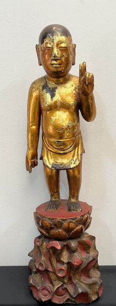 null VIETNAM - late 19th century:
BUDDHA standing on his lotus flower, in carved...