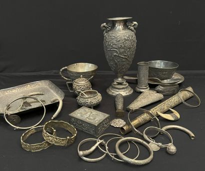 null LOT IN METAL AND SILVER including: a scabbard with repoussé decoration of battles,...