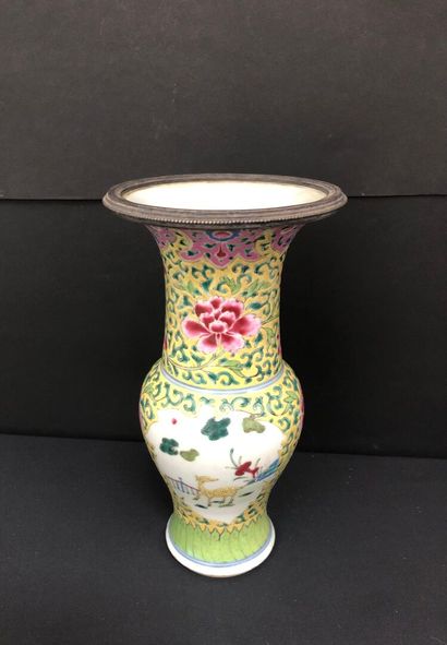 null CHINA - 19th century :
Enameled porcelain baluster vase with yellow family polychrome...