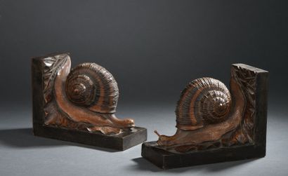 null Serre-livres Escargot, en bois taille directe (manque trois antennes).
H.17...