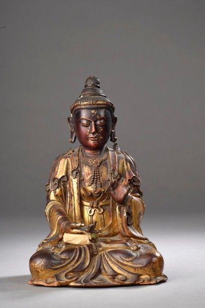 Statuette de Bouddha assis en bois laqué

Chine,...