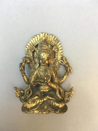 null STATUETTE DE DIVINITE en bronze doré
Népal, XIXe siècle
À deux paires de bras,...