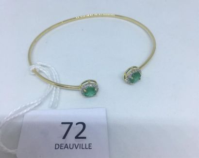 null Bracelet jonc, rigide, ouvert, en or jaune 18K (750 ) terminé par deux motifs,...