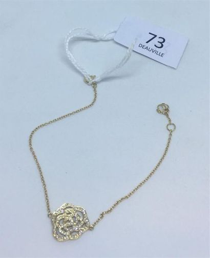 null Bracelet en or jaune 18K (750 )au motif d'une rose pavée de diamants.
Chaîne...