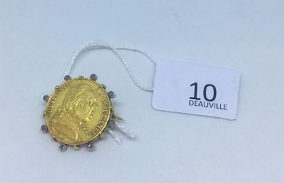 null Broche en or jaune 18K (750 ) retenant une pièce d'or, rehaussée de huit
petits...