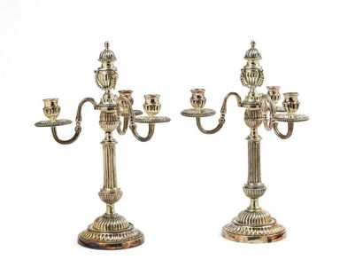null Pair of silver plated metal candelabra with three lights, fluted shafts and...
