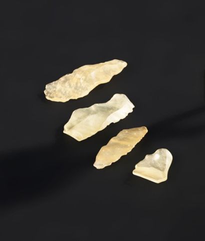 null A set of four prehistoric tools cut from the famous Libyan glass for which scientists...