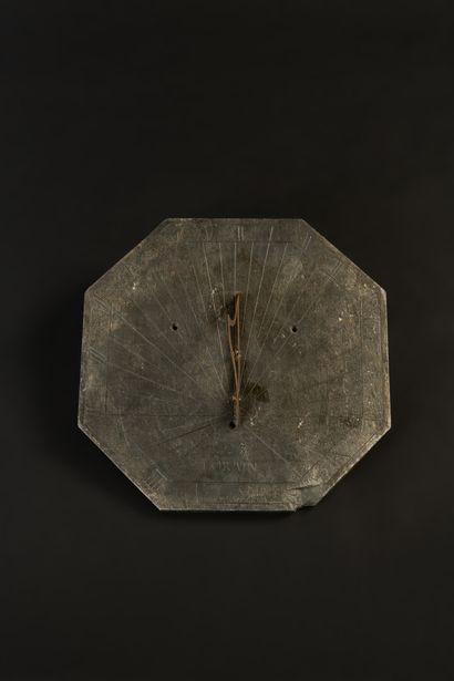 null Octagonal slate sundial dated 1796 and signed Lorain. Chips in the lower part...