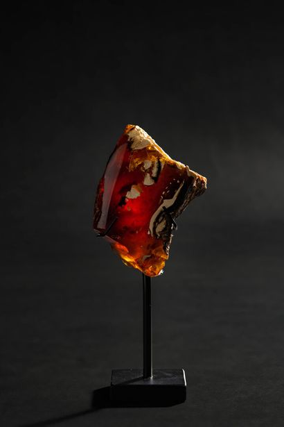 null Exceptional block of electric blue amber. Red/yellow color in natural light,...