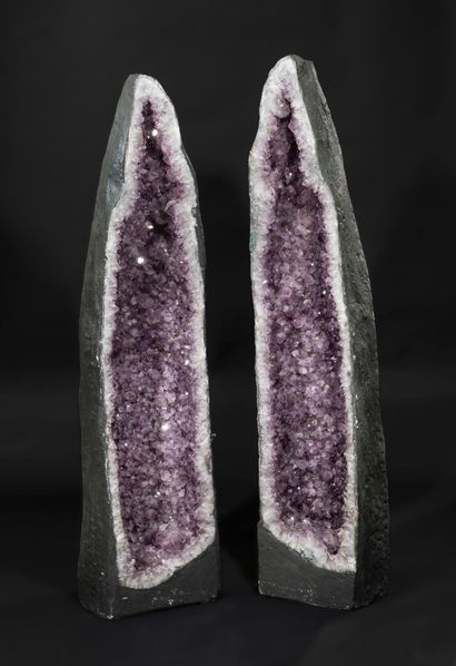 Rare pair of the same amethyst geode.

This...
