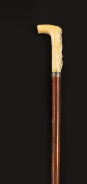 null Ivory cane with knob carved with a female bust in a scroll cartouche