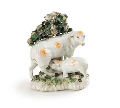 null STATTFORDSHIRE

Porcelain group representing a sheep and a lamb near a flowering...