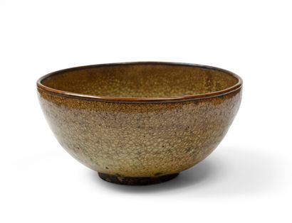 null JAPANESE stoneware hemispherical bowl with a green-brown cracked celadon glaze,...